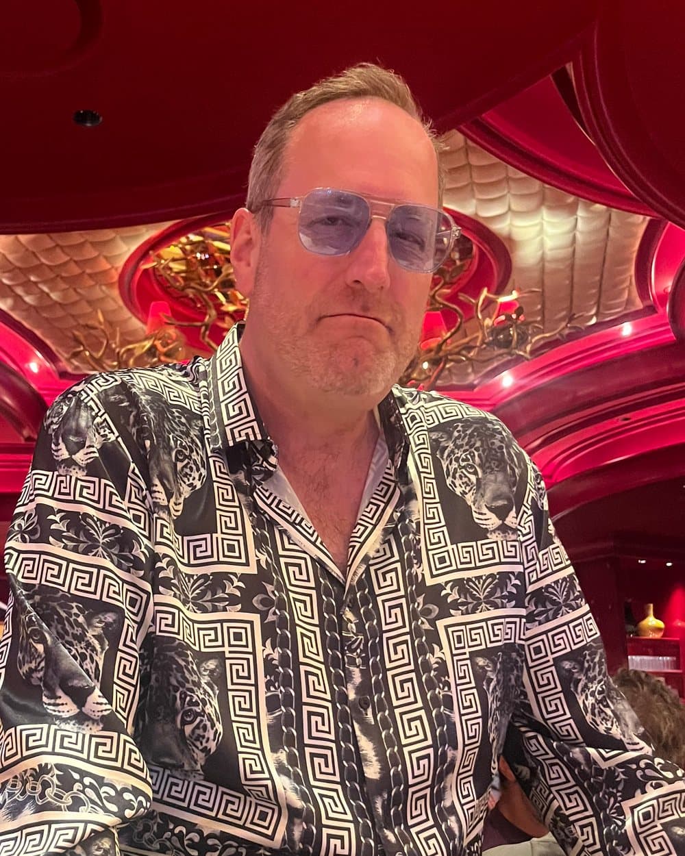 The last confirmed photograph of Mayor Joe Grube, in a patterned silk shirt and tinted glasses.